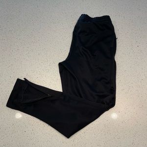 Black adidas soccer pants with zip ankle detail